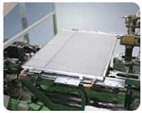 Condenser core on conveyor